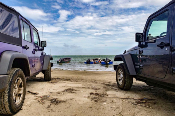 Two Jeeps on a Caribbean beach in Grenada